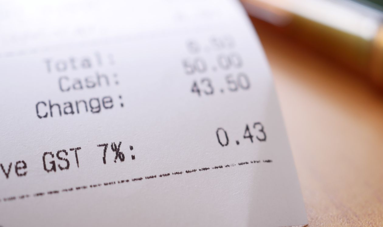 Close up of a retail receipt showing sales tax breakdown and invoice details