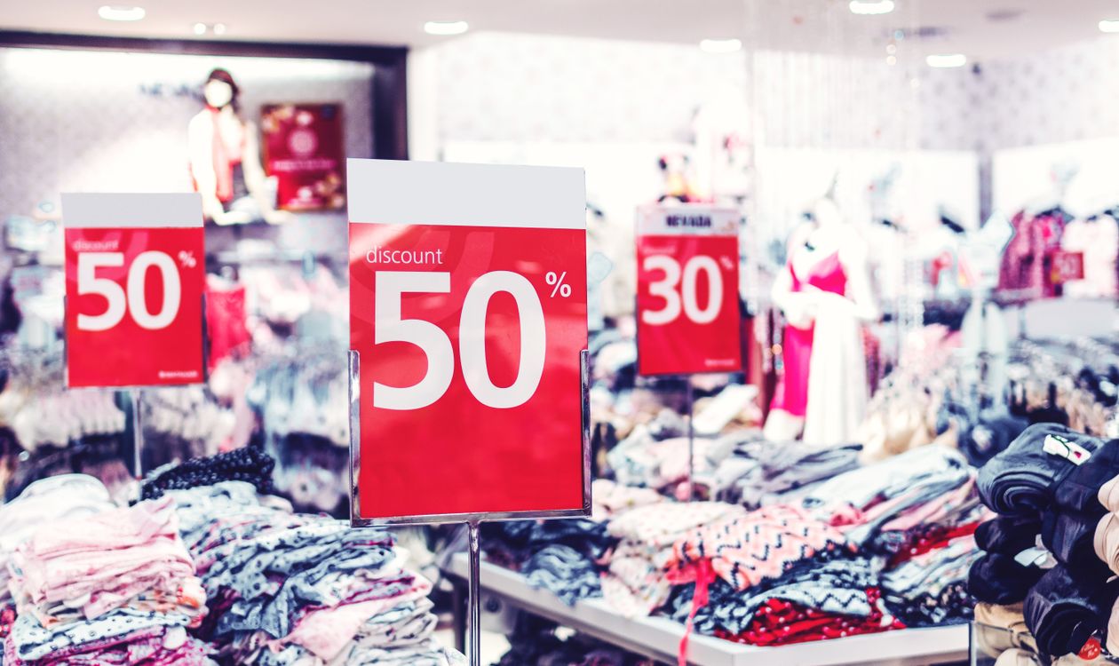 Discount signage in a retail clothing store during a markdown period