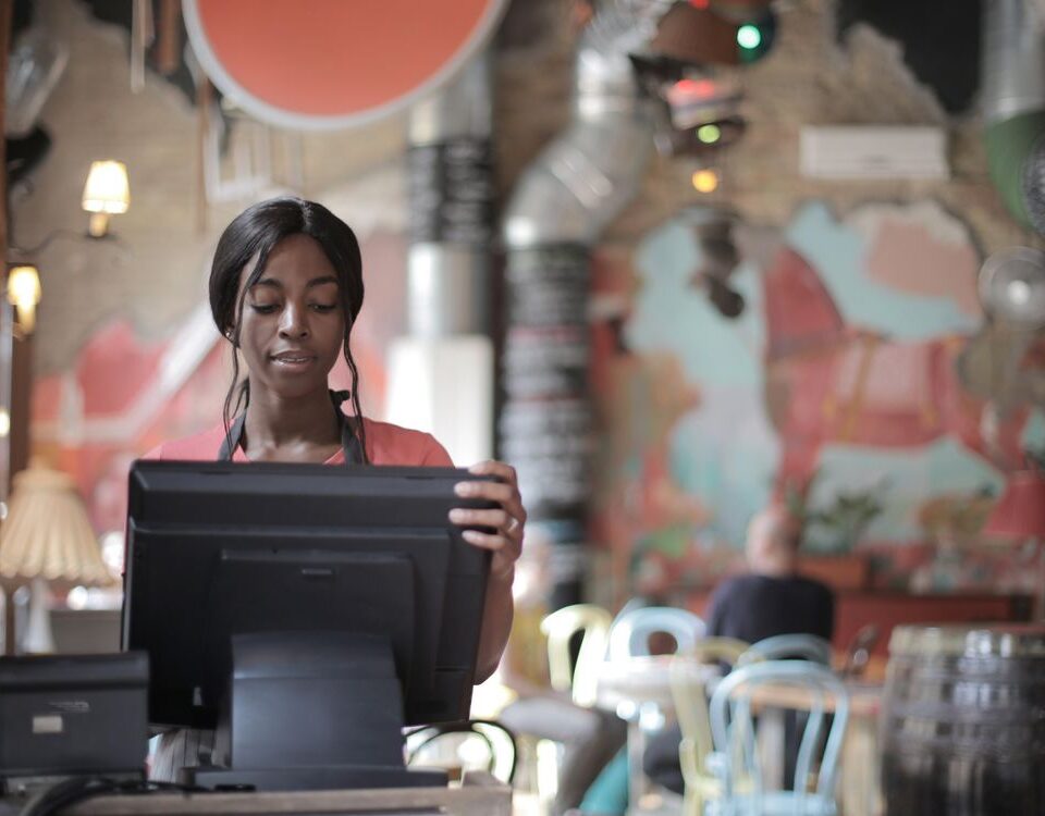 Restaurant cashier processing a bill on a POS system in Punjab